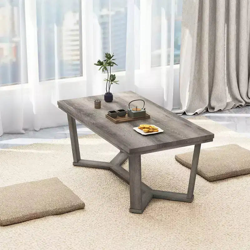 Table basse rectangulaire grise avec piètement croisé à 4 pieds, 1 à 4 places