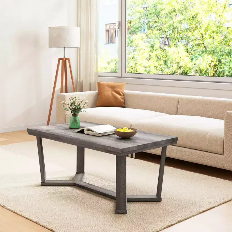 Table basse rectangulaire grise avec piètement croisé à 4 pieds, 1 à 4 places