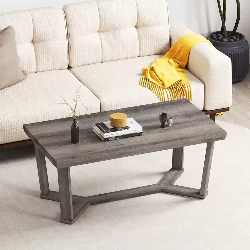 Table basse rectangulaire grise avec piètement croisé à 4 pieds, 1 à 4 places