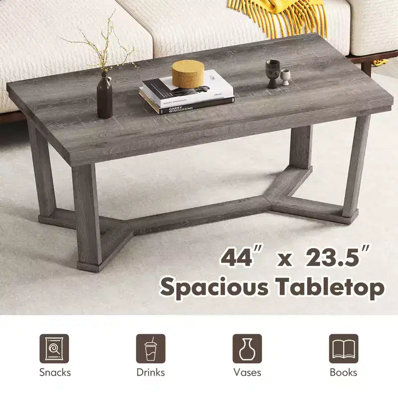 Table basse rectangulaire grise avec piètement croisé à 4 pieds, 1 à 4 places